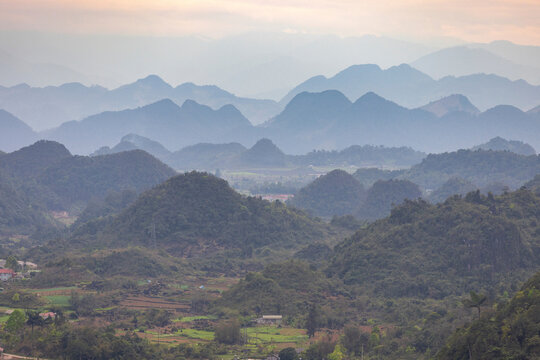 Mountainous landscape covered in lush vegetation, viewed from Tham Luong Cave, Ha Giang, Vietnam; Minh Tan, Vi Xuyen, Ha Giang, Vietnam