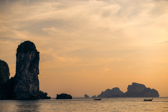 Beautiful sunset sky over the rugged coastline at Ao Nang Beach, Krabi, Thailand; Krabi, Thailand