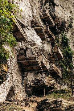 Coffins on a cliff in the ancient village of Ke'te Kesu' in the Toraja Highlands of Indonesia; Ke'te' Kesu' Toraja, Rante Pao area, North Toraja, South Sulawesi, Indonesia