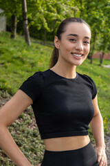 Athletic woman in sportswear posing outdoor preparing for outdoor training