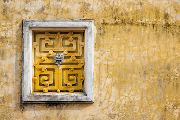 Close-up detail of ornamental decor on the facade of Van Son Pagoda, Con Dao, Vietnam; Con Dao, Ba Ria - Vung Tau, Vietnam