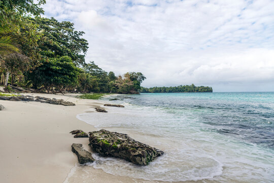 Beautiful white sand beach beach named Pantai Kelapa Lima (5 coconuts) along the coast of Central Sulawesi, Indonesia; Kelapa Lima, Banggai Laut, Central Sulawesi, Indonesia