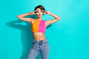 Photo of excited flirty lady dressed colorful top showing two v-signs cover eyes empty space...