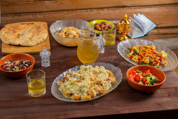 A festively laid table with traditional food for the holiday of Urba Bayram