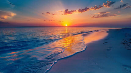 Obraz premium Stunning sunset over a tranquil beach, with vibrant colors and calm waters