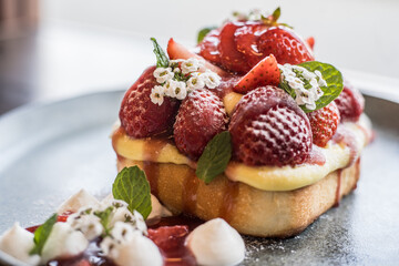 A french toast decorated with fresh strawberries