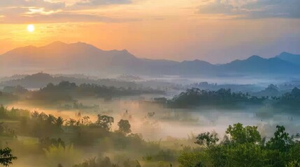 Fototapeta premium Beautiful Sunrise Sky with Sea of the mist of fog in the morning on Khao Luang mountain in Ramkhamhaeng National Park,Sukhothai province Thailand 