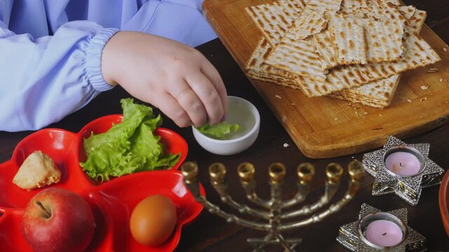 Jewish woman eating maror with matzoh meal Pesach Seder