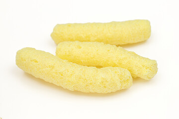 Three finger long corn puffs isolated on white backround