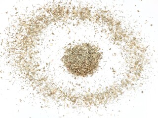 Dried pile of aromatic lemongrass on a bright background.