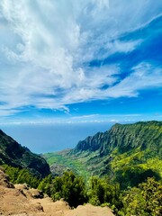 Lush green mountain with blue sky