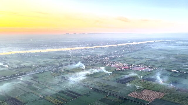 The sunrise of Luxor, enjoying from a bird's eye view from a hot air balloon the majesty of Ancient Egypt and the desert surrounding the famous Nile River.