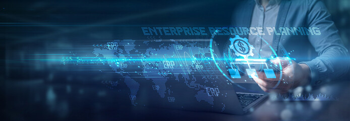 Businessman using laptop and mobile on global network connection of ERP (Enterprise Resource Planning), financial integration, Globalization innovation and ERP, growth and connectivity.