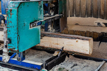 A modern sawmill. Industrial sawing of planks from logs. A series of pictures