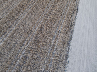 View from above of agriculture land with snow in winter