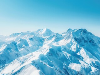 Obraz premium Snow-capped mountains under a clear blue sky, pristine and majestic.