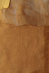 Gold, bronze, brown paper Wave torn frame painting wall. Abstract glow texture copy space relief background.