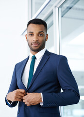 Confident, portrait or black businessman in office with suit, skills and investment banking career. Blazer, broker and African banker in commercial or corporate institution with style or pride