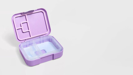 Closeup of small bento lunchbox isolated on copy-space background.