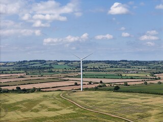 Drone shot of a wind turbine on a sunny day in Berryfields Aylesbury Wind Turbine wind farm, England