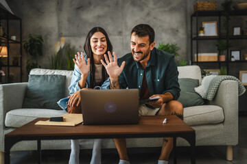 couple work from home on laptop and have video call consultation