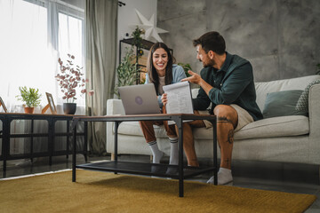 couple work from home on laptop and have video call consultation