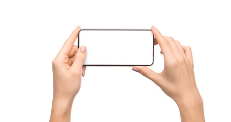Female hands holding smartphone with blank screen taking photo, isolated on white background, free space