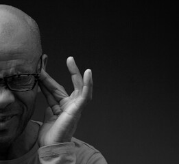 deaf man suffering from deafness and hearing loss on grey background with people stock image stock...