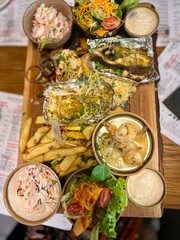 Seafood platter in a restaurant on a wooden board at Lodz, Poland