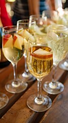 Apple Cider Mimosas in Glasses on Wooden Table