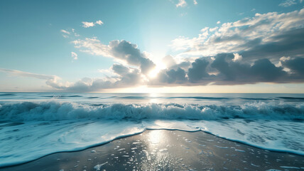Gentle waves kiss the shore as the sun rises, casting a serene glow over the horizon.