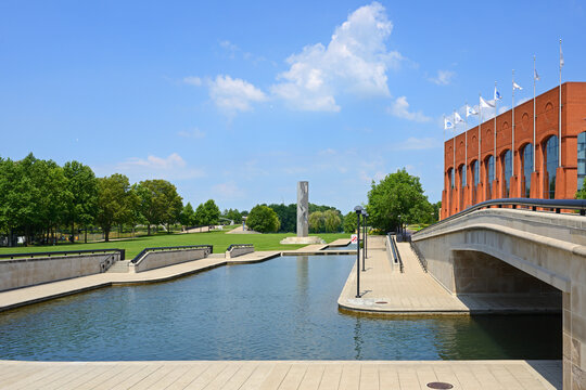 Totem and NCAA Hall of Champions on Indiana Central Canal bank in White River State Park. Indianapolis, Indiana, United States