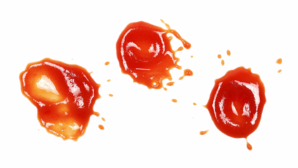 Red ketchup splashes isolated on white background, tomato puree texture	