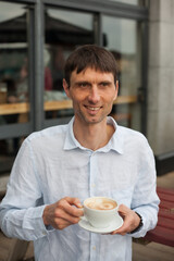 joyful cheerful middle-aged man in nature on a warm sunny day