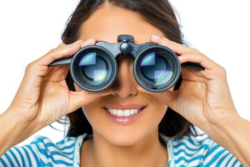 A woman smiles brightly as she holds binoculars to her eyes, eager to discover what lies ahead