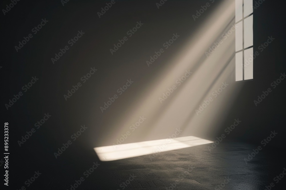 Aufkleber A dark room with sunlight entering from outside through an open window, creating a striking contrast