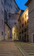 Fototapeta premium Perugia - The gate Arco di Sant Ercolano at dusk.