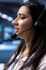 Data center agent in remote call, providing customer support, troubleshooting system bugs. IT...