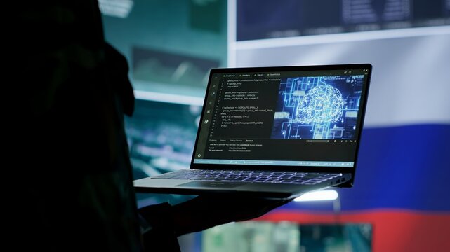 Russian IT expert uses new technology machine learning to spread fake news and cyber war propaganda, making national threats via neural network digital science. Army stealing information. Camera A.