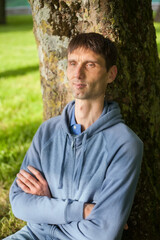 joyful cheerful middle-aged man in nature on a warm sunny day