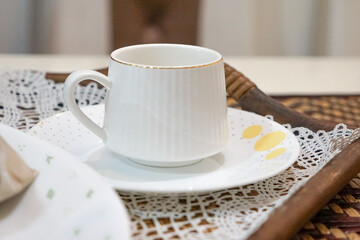 A white cup in a tray