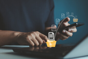 Data transfer, Transfer file of data between folder, Backup data, Exchange of file on folder, Send of document in internet, DMS. Virtual document loading to another folder and hand holding smartphone.