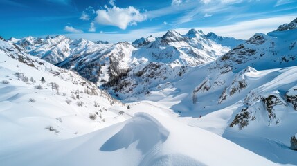 Obraz premium A breathtaking landscape of snow-covered mountains under a clear blue sky, showcasing the beauty and serenity of a winter wonderland in a pristine natural environment.