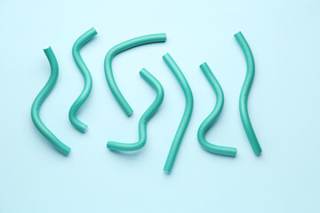 Hair curlers on blue background