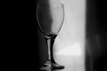 empty wine glass in low light