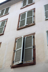 Facade of Traditional Building with White Shutters