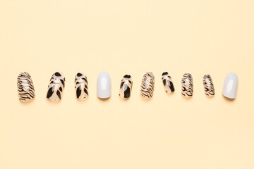 Press-on nails on beige background