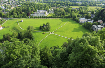 Salzburg, Austria - May 28, 2016: Summer view of park with lawn and trees amid downtown
