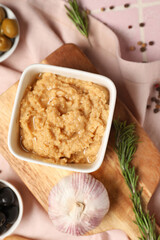 Bowl with tasty hummus on table, closeup
