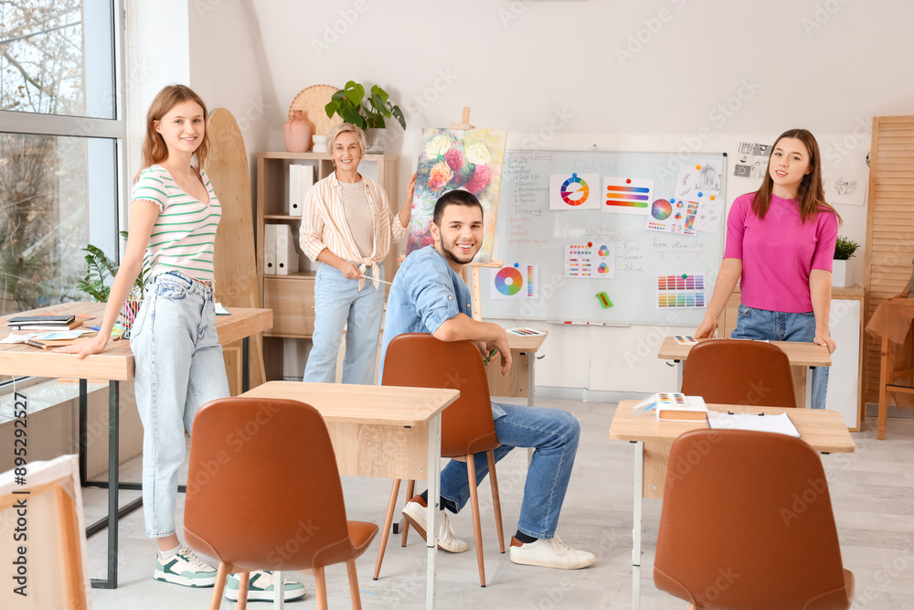 Poster Young students with teacher during lecture in art school